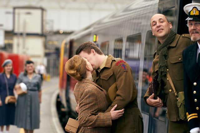 Actors stage a reenactment of saying goodbye to loved ones during the Second World War.