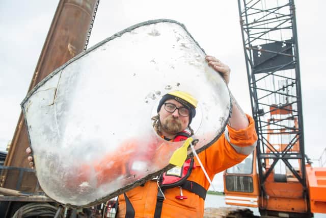 Ben Saunders of Wessex archaeology with a part of the windshield of the plane.
Picture: Habibur Rahman
