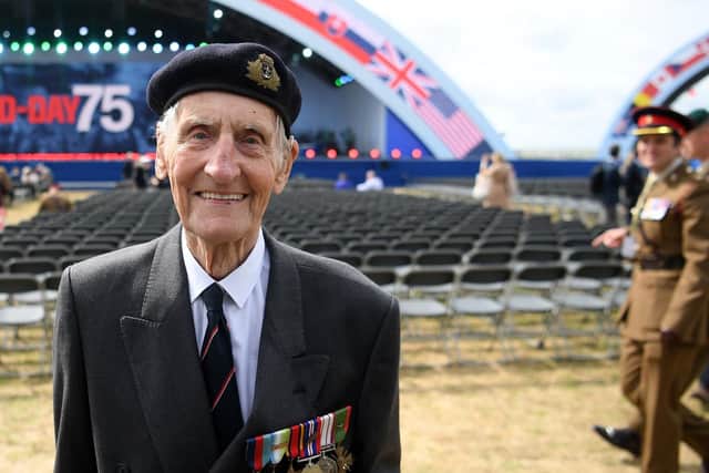 Former British Royal Marine, and D-Day veteran Jim Booth poses for a photograph
