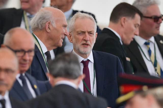 Britain's opposition Labour Party leader Jeremy Corbyn (R) speaks with outgoing Liberal Democratic Patry leader Vince Cable (L)