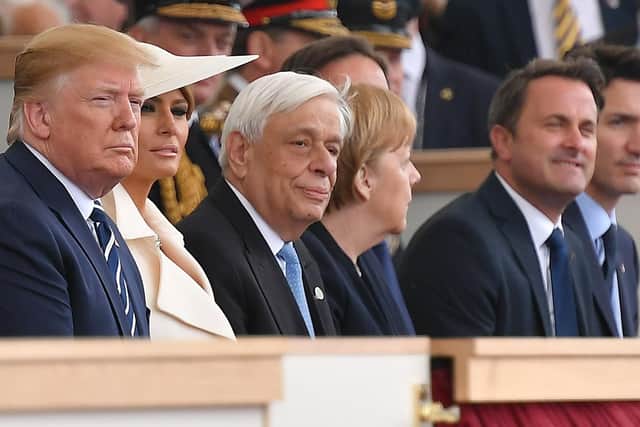 US President Donald Trump (L), US First Lady Melania Trump (2L), Greek President Prokopis Pavlopoulos (3L), German Chancellor Angela Merkel (C), Luxembourg's Prime Minister Xavier Bettel (2R) and Canadian Prime Minister Justin Trudeau