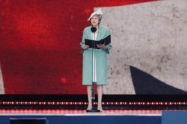 Theresa May reads a poignant letter during D-Day 75 ceremony Picture: Chris Moorhouse