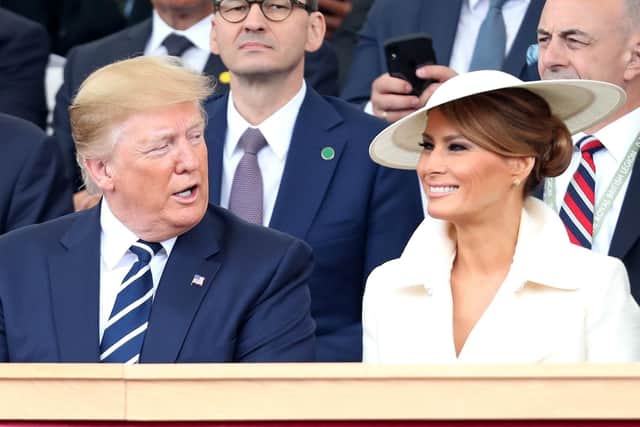 US President Donald Trump talks with US First Lady Melania Trump in the royal box. Picture: CHRIS JACKSON/AFP/Getty Images