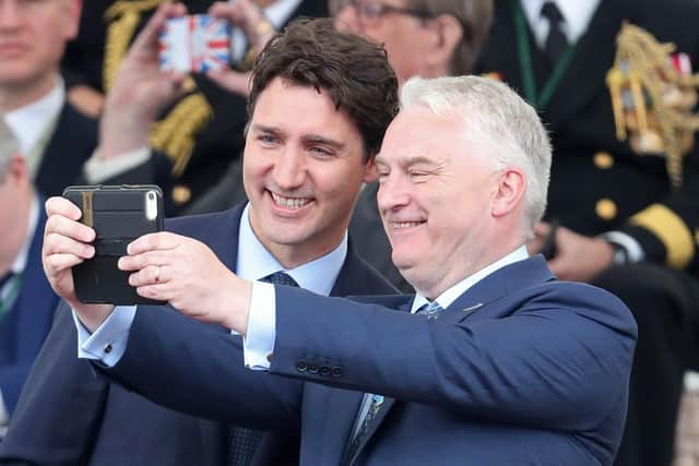 Canadian Prime Minister Justin Trudeau (L) poses for a selfie photograph with Leader of Portsmouth City Council Gerald Vernon-Jackson during the event. Picture: CHRIS JACKSON/AFP/Getty Images