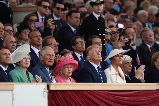 President of the United States, Donald Trump and First Lady of the United States, Melania Trump watch the fly-past next to President of the France, Emmanuel Macron (L) British Prime Minister, Theresa May, Prince Charles, Prince of Wales, Queen Elizabeth II, President of Greece, Prokopis Pavlopoulos and Chancellor of Germany, Angela Merkel during the D-Day Commemorations. Picture: Photo by Dan Kitwood/Getty Images