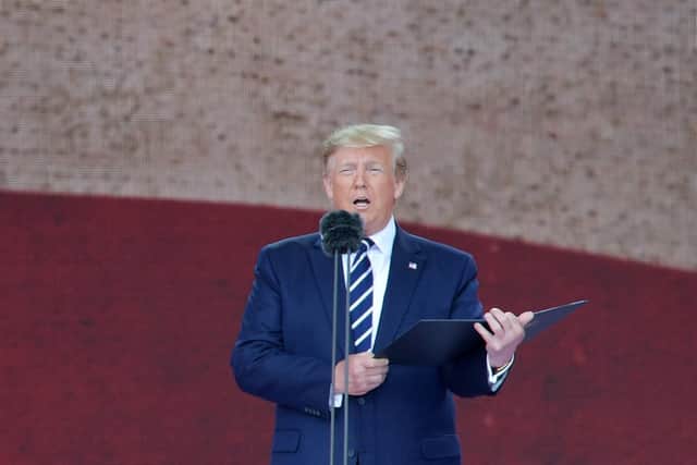 US President Donald Trump stands and speaks during the event. Picture: DANIEL LEAL-OLIVAS/AFP/Getty Images