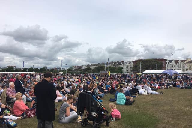 Crowds watch the D-Day ceremony on big screen in Southsea.