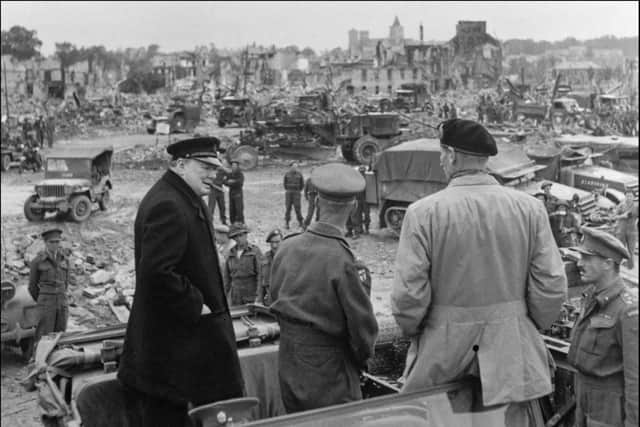 (From left) British Prime minister Winston Churchill, Sir Miles Dempsey, British 2nd Army commandant, and British general Marshal Bernard Montgomery visit destroyed city of Caen, 23 July 1944 after Allied forces stormed the Normandy beaches on D-Day. D-Day, 06 June 1944 is still one of the world's most gut-wrenching and consequential battles, as the Allied landing in Normandy led to the liberation of France which marked the turning point in the Western theater of World War II. (Photo credit should read STF/AFP/Getty Images)