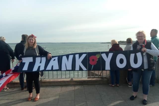 Lucy Moffit (left) and mother, Kathryn Moffit, sum up the views of the crowd.