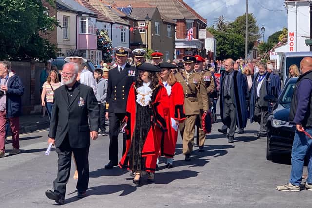 The procession marches down Priory Road for Hardway's D-Day service. Picture: Richard Bourke