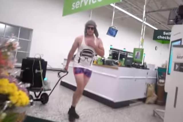 YouTube prankster Lee Marshall, 34, who goes by the name DiscoBoy on the streaming site has been convicted of assault by beating against an Asda supermarket night manager.
Pictured: Lee Marshall wearing shorts, a vest and a hat inside the Asda store