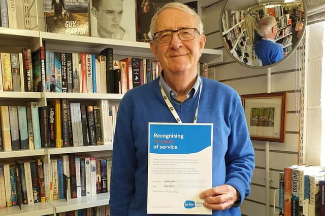 Sue Ryder Emsworth volunteer Jeremy with his certificate for 10 years of service