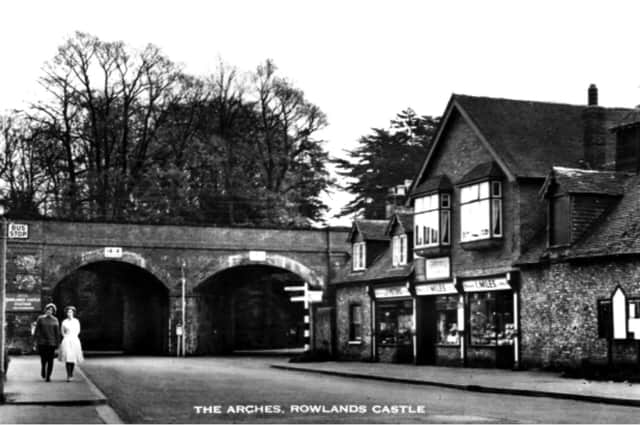An unchanged scene at Rowlands Castle with Ivy Miles's shop alongside the arches. Picture: Ralph Cousins's collection.