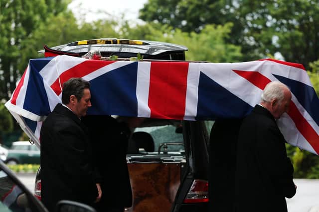 Col Dockerill's coffin is borne into the chapel. Funeral of Col Geoffrey Dockerill at Portchester Crematorium. Picture: Chris Moorhouse (120619-30)
