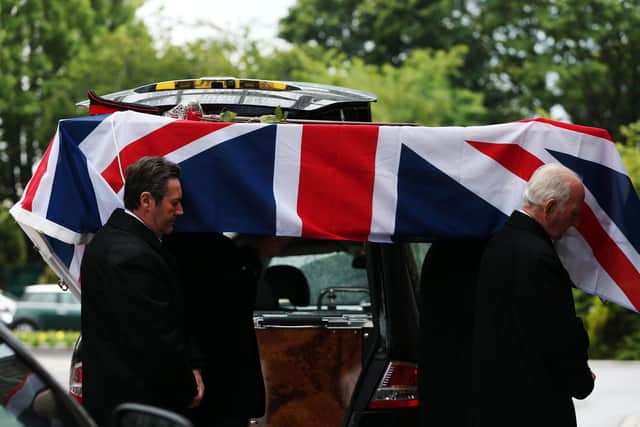 Col Dockerill's coffin is borne into the chapel. Funeral of Col Geoffrey Dockerill at Portchester Crematorium.            Picture: Chris Moorhouse           (120619-30)