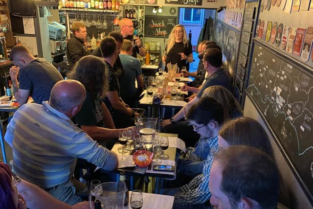 Patrons enjoy the first beer tasting event held at the Four Ale Tap Room to celebrate its birthday.