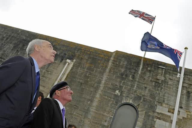 David Colville, who worked on the Falklands during the war, alongside Chris Purcell, who served aboard HMS Sheffield, at the flag-raising in Old Portsmouth this morning. Picture: Ian Hargreaves  (140619-6)