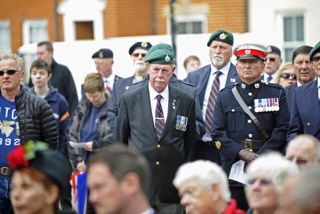 Veterans, including Stewart Bratherton, second-right, watch on as a flag is raised at The Falklands Memorial in Old Portsmouth to mark the 37th anniversary of the end of the Falklands War. Picture: Ian Hargreaves  (140619-5)