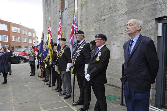 Standard bearers and David Colville, from Southsea, at the flag-raising at The Falklands Memorial in Old Portsmouth this morning. Picture: Ian Hargreaves (140619-3)