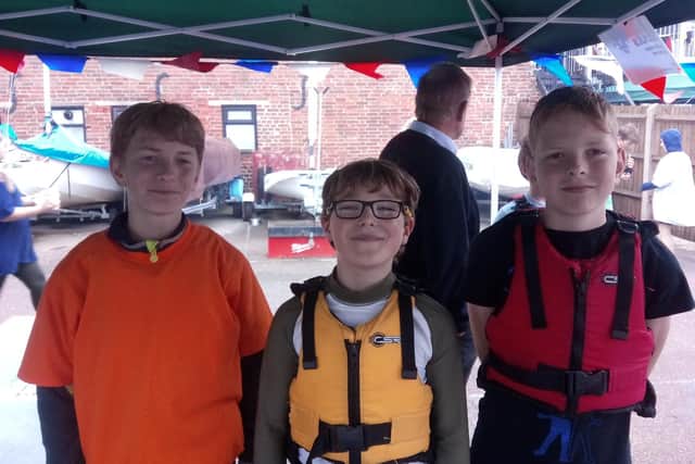 (L-R) Sea scouts, Jason Nash, 13, Oscar Molyneaux, 10, and Owen Lacy, 11.