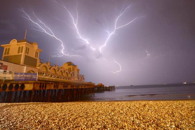 Lightning striking behind South Parade Pier. Picture: Tony Wallace