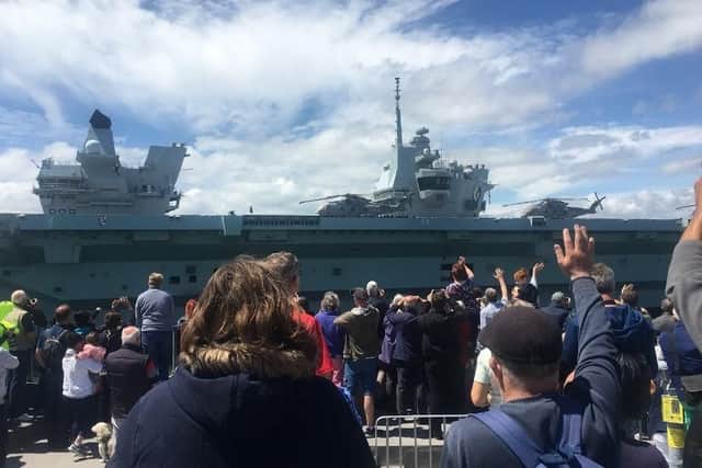 Families say goodbye to HMS Queen Elizabeth as she sets sail from Portsmouth Harbour. Picture: Louisa Moth