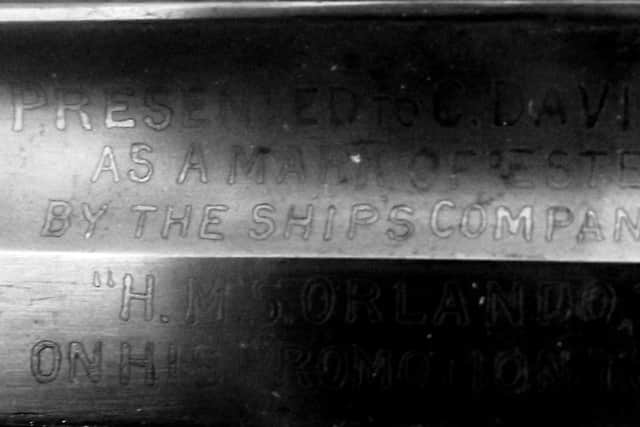 The inscription on the blade of the sword presented to WO Davidge.