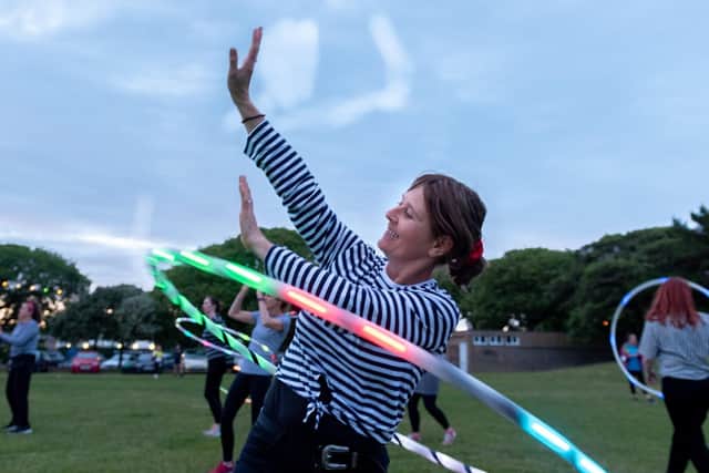 Moonlit Memories Walk 2019 for Rowans Hospice along the Seafront and Old Portsmouth - LED hula hoop display.  Picture: Vernon Nash (150619-009)
