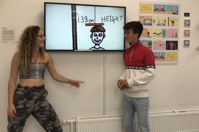 George Ashby and his sister Imogen Ashby in front of her animation at the Oxford Brookes University art show in May.