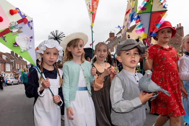 The carnival parade processes through the streets of Portchester to Portchester Castle. Picture: Vernon Nash (150619-042)