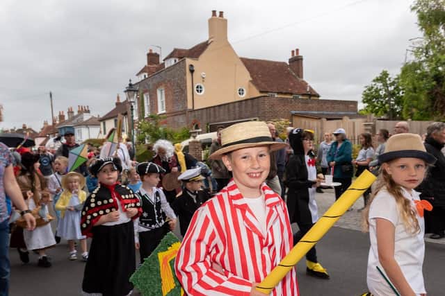 The carnival parade processes through the streets of Portchester to Portchester Castle. Picture: Vernon Nash (150619-041)