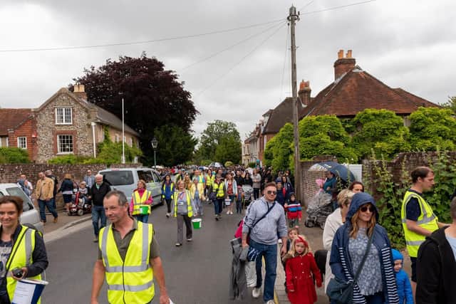 The carnival parade processes through the streets of Portchester to Portchester Castle. Picture: Vernon Nash (150619-053)