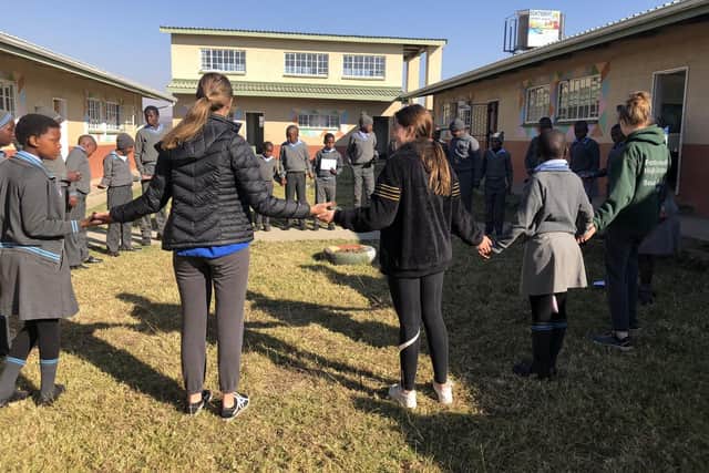 Portsmouth High School Sixth Form students with pupils from Schitzdrift Rural School in South Africa.