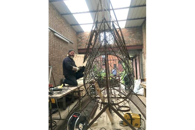 The big fish sculpture that is to appear at the food festival at Gunwharf Quays with artist Pete Codling.