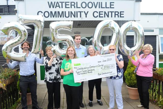 Pictured is: (l-r) Gary Garnett, contracts manager for Purkiss Builders, Angela Riley, centre manager, Jacqui Benham, community champion at Asda Waterlooville, Tom Newey, deputy store manager at Asda Waterlooville, Pat James, volunteer, Joan Manktelow, chair of trustees and Judy Clementson, treasurer. Picture: Sarah Standing (200619-1232)