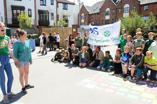 (left and right) Anna Douglas (14) and Amelia Cox (13) lead the protest.

Picture: Sarah Standing (210619-1419)