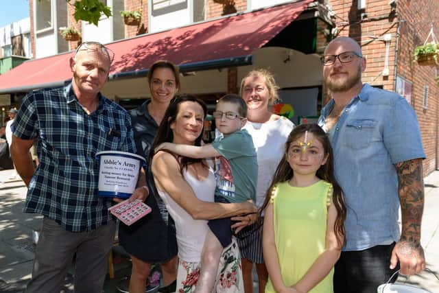 Catch Line: Fundraising day for youngster with inoperable tumour
Location: Red Lion Pub in Portchester. 
Story: Harry St Ledger, from Portchester has an inoperable brain tumour. His family have put on a fundraising day so he can tick things off his bucket list and  they are splitting the profits with charity Abbies Army who fund research into DIPG - (L-R) Chris Young, Kerry-Ann Regan, Fiona Lear, Harry St Ledger, Claire Wallace (landlady of the Red Lion), Emonie St Ledger (9yrs), Cairan St Ledger.
Picture: Duncan Shepherd