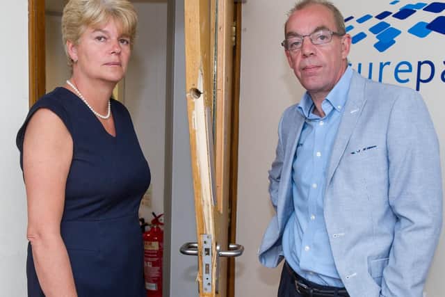 Owners Jacky and Peter Barnett alongside one of the many broken doors in the building. Picture: Habibur Rahman