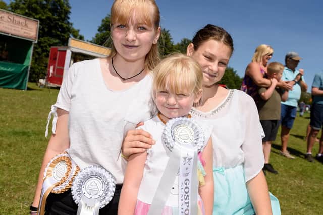 Young bakers (L-R) Haley Ford (14yrs) (1st 'Under 16 Choc Brownies', 2nd 'Undecocated Muffins'), Holly Ford (4yrs), Charlotte Storey (13yrs). Picture: Duncan Shepherd