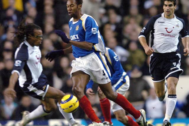 Jhon Viafara evades Spurs' Edgar Davids in Pompey colours Picture: Matt Scott-Joynt.