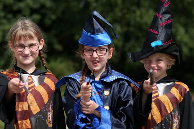 Young wizards, Katie Hale, eight, Lexi Kerens, nine, and Josh Evans, 10. 
Picture: Chris Moorhouse       (260619-10)