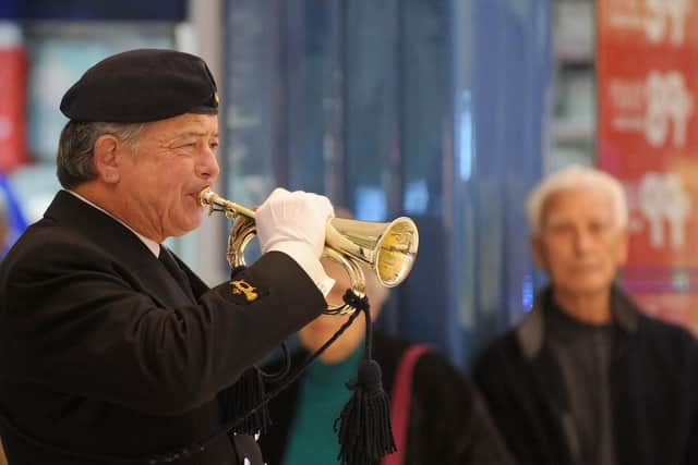 Tony Crisp, left, in his days as a Royal Naval Association bugler. Picture: Sarah Standing (151817-8906)