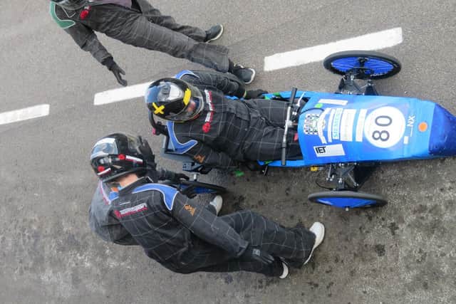In addition to racing the cars the pupils also provide mechanical support in the pit stop.