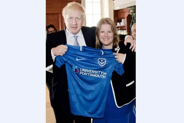 Boris Johnson pictured with Councillor Donna Jones holding up a Portsmouth Football Club shirt. Photo: Ashton Keiditsch
