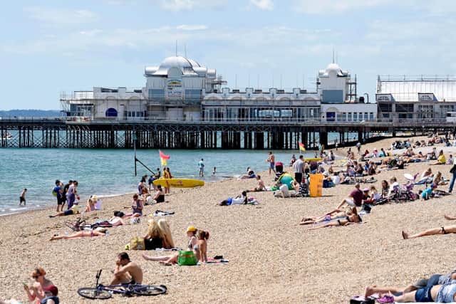People enjoy the hot and sunny weather at Southsea Beach, Portsmouth.  Solent News & Photo Agency