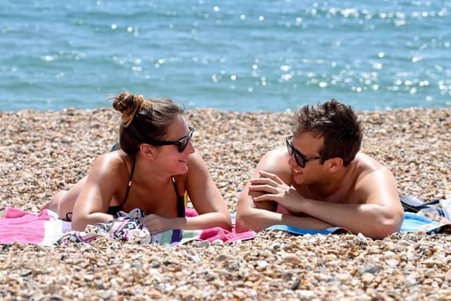 People enjoy the hot and sunny weather at Southsea Beach, Portsmouth.  Solent News & Photo Agency