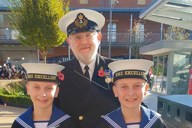 WO1 Trevor Coleman with two of the naval cadets from HMS Excellent at the poppy launch.