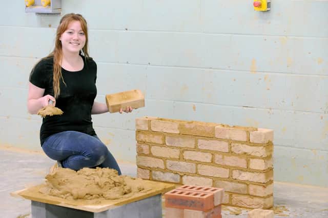 Abbey Blackman (19) from Waterlooville, has graduated in her bricklaying course at Highbury College and was the only girl on her course.Picture: Sarah Standing (280619-9982)