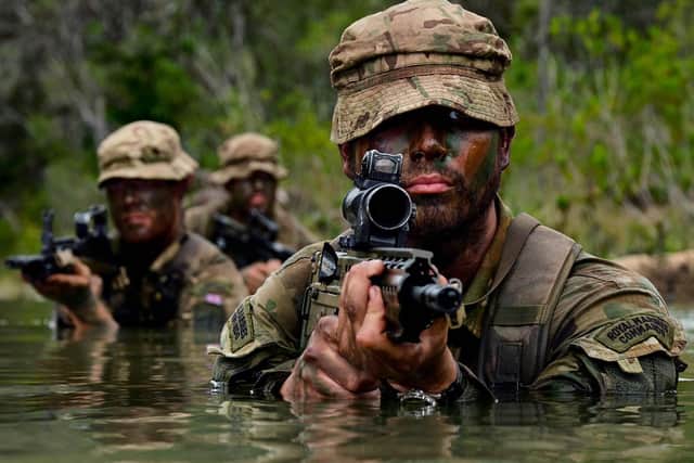 Pictured is Marine John Allen of Alpha Company, 40 Commando Royal Marines with an Army Commando and a Marine patrolling in the river at Belize as part of Exercise Curry Trail. This exercise sees participants develop jungle warfare capabilities for Commando Forces up to and including live fire section drills. February 14, 2019. Consent form signed and held at 30 Cdo. Picture: PO(Phot) Si Ethell/Royal Navy
