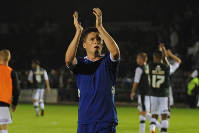 Alex Grant applauds the travelling fans after Pompey's 3-0 League Cup loss to Plymouth in August 2012. Picture: Ian Hargreaves